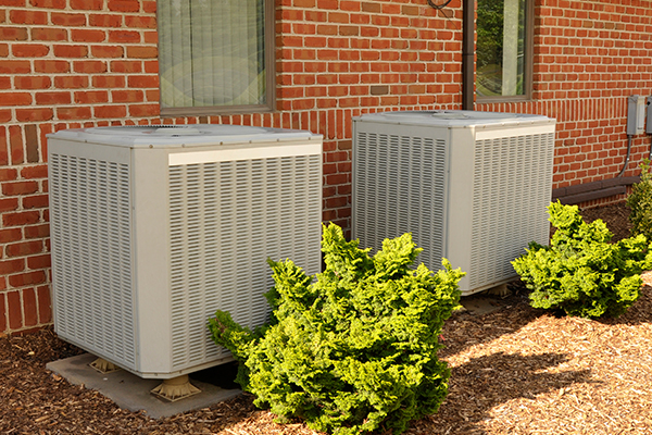 An image showing a air condition system on the side of an office building